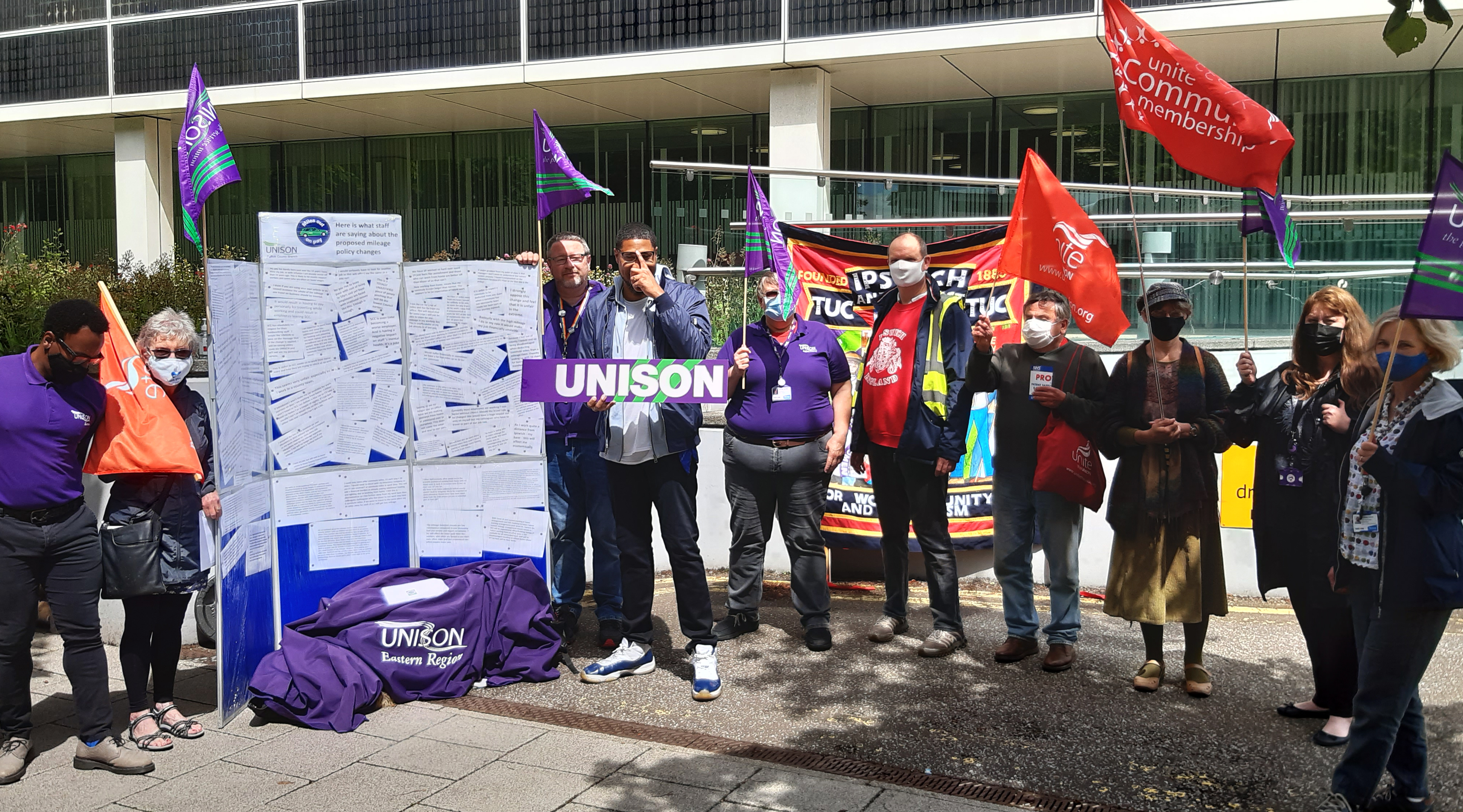 UNISON members hold flags outside Suffolk County Council's headquarters