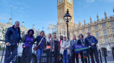 A group of care workers standing outside parliament