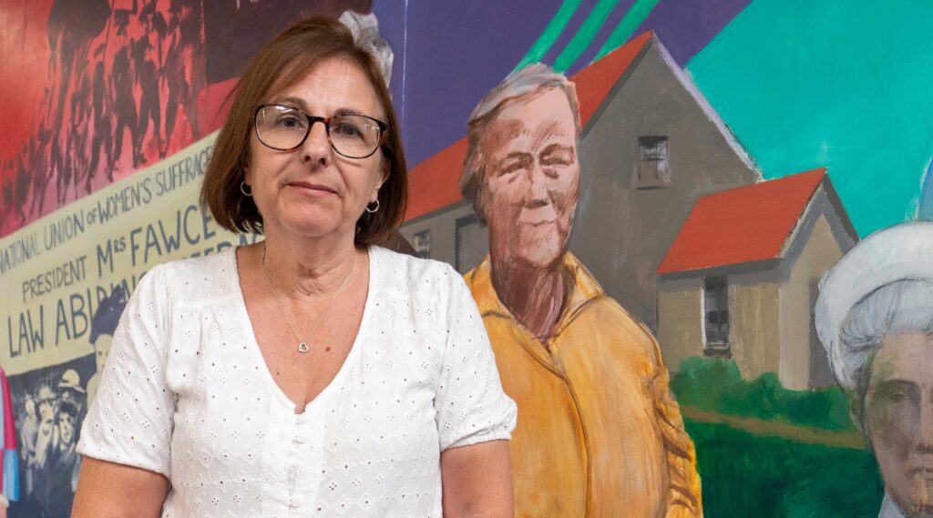 Susan in front of UNISON's mural