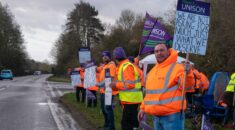 A group of pickets illicit support from passing motorists