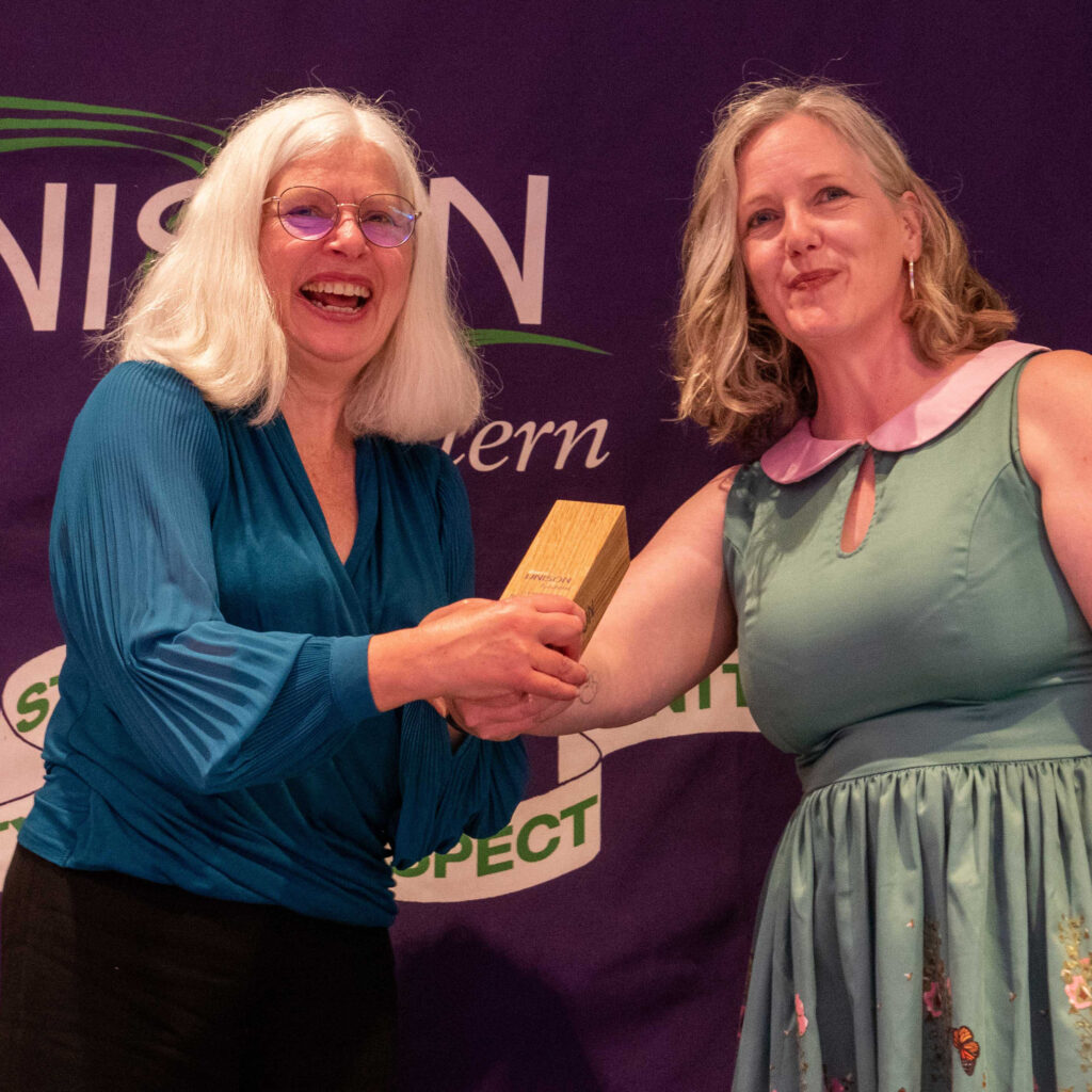 Norfolk County's Frances receives the award from Becky