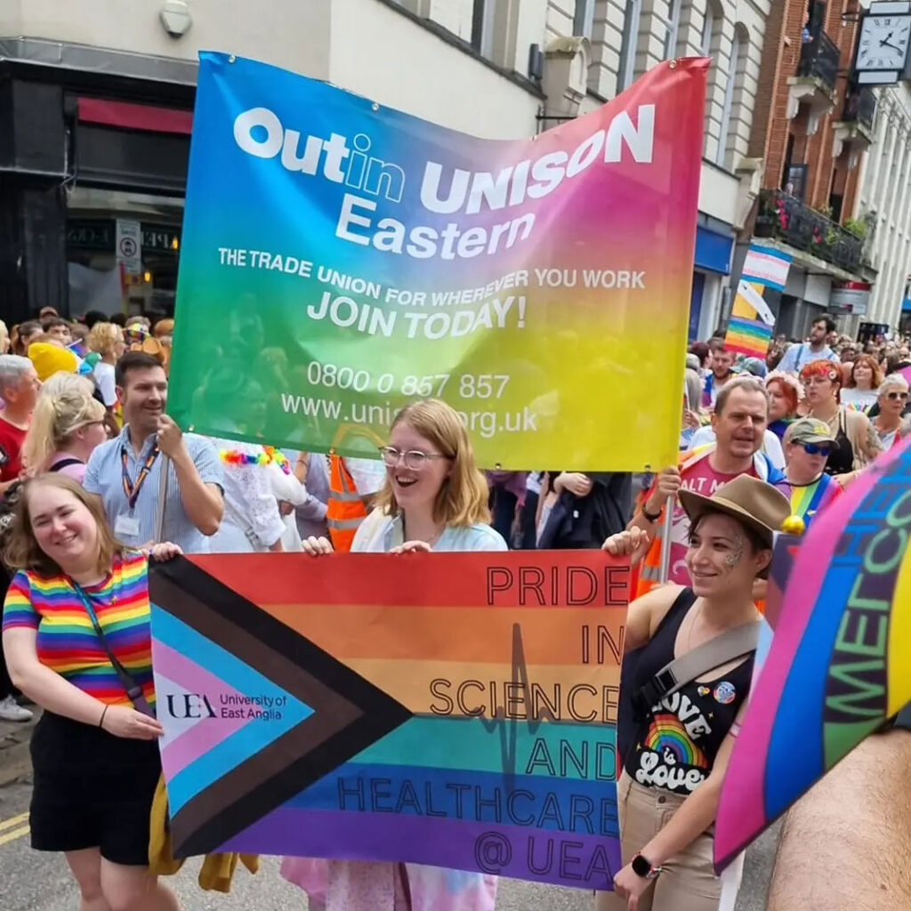 Ben and the UNISON banner join the Norwich Pride march