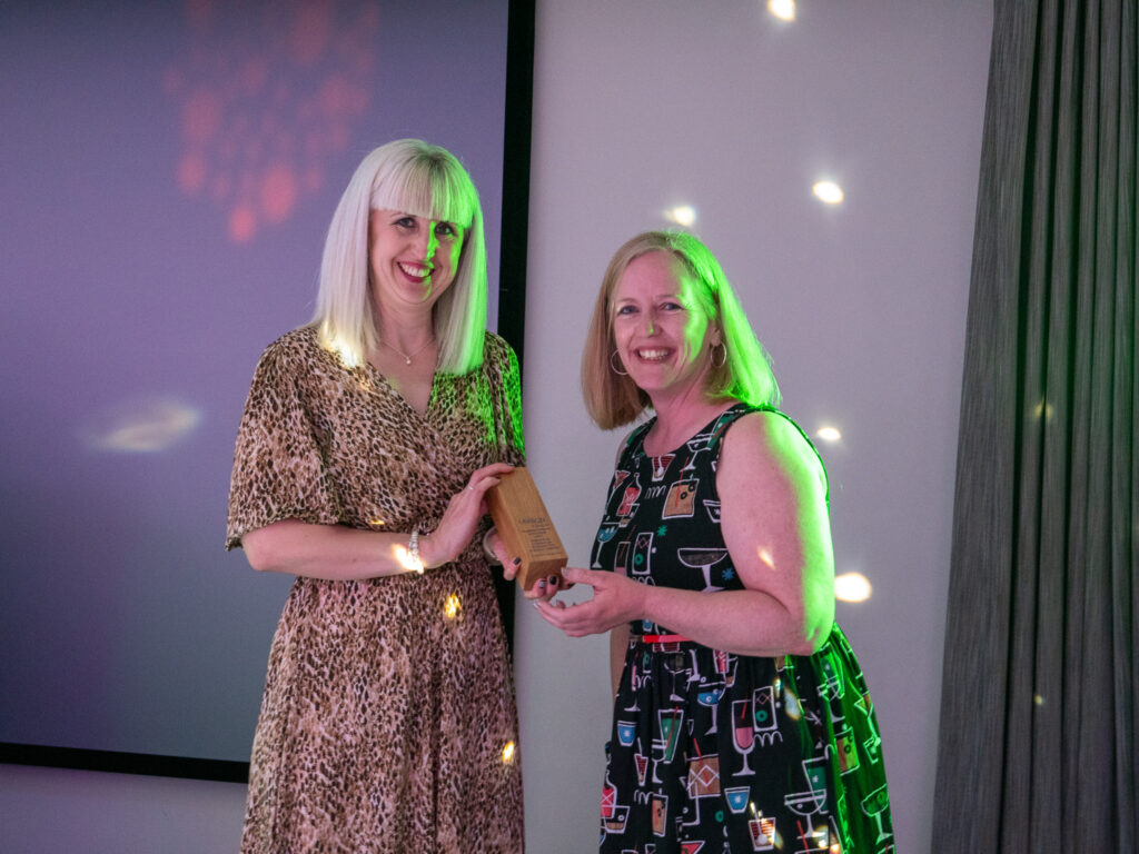 Jo Bateman receives here equalities activist award from regional convenor Becky Tye