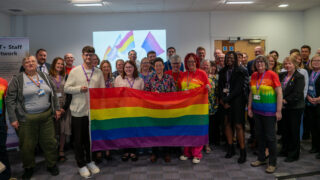 Posing for a photo at an Year of LGBT+ Workers event at Ipswich Borough Council