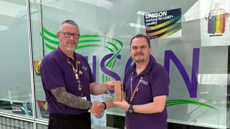Peter Oates (right) receives his award from deputy regional convenor Neil Bland