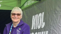 Helen smiles in a UNISON gazebo